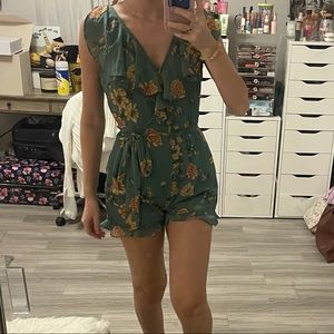 Floral print ruffle romper with waist tie